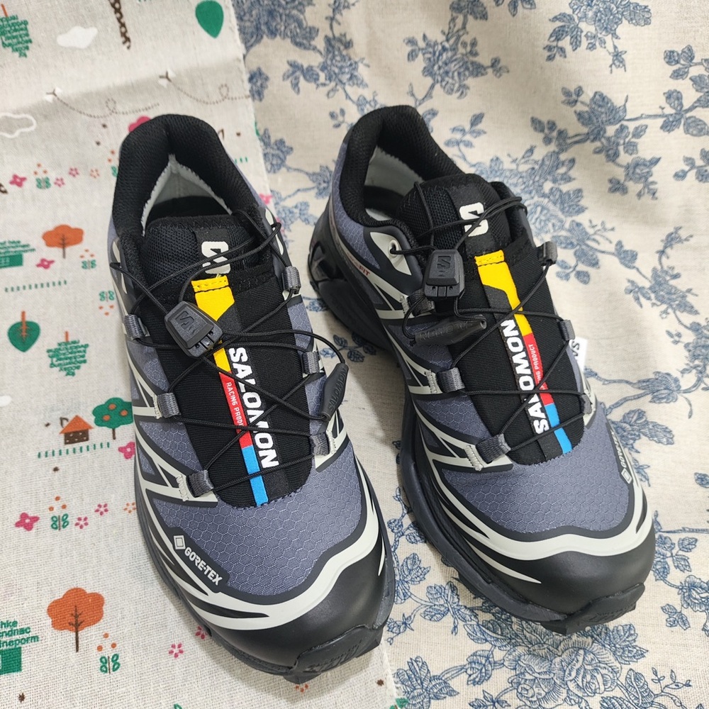 Salomon Men's Trail Shoes in Gray with Black, Yellow, Red, and Blue Accents